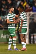 18 April 2022; Shamrock Rovers players Danny Mandroiu, left, and Aidomo Emakhu after the SSE Airtricity League Premier Division match between Shamrock Rovers and Dundalk at Tallaght Stadium in Dublin. Photo by Eóin Noonan/Sportsfile
