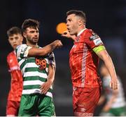 18 April 2022; Brian Gartland of Dundalk tussles with Danny Mandroiu of Shamrock Rovers during the SSE Airtricity League Premier Division match between Shamrock Rovers and Dundalk at Tallaght Stadium in Dublin.  Photo by Eóin Noonan/Sportsfile