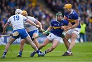 17 April 2022; Cathal Barrett of Tipperary, supported by teammate Ronan Maher, gets away from Shane Bennett of Waterford, 19, during the Munster GAA Hurling Senior Championship Round 1 match between Waterford and Tipperary at Walsh Park in Waterford. Photo by Piaras Ó Mídheach/Sportsfile