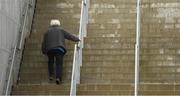 17 April 2022; A supporter makes his way up a set of steps on his way to the game ahead of the Munster GAA Hurling Senior Championship Round 1 match between Cork and Limerick at Páirc Uí Chaoimh in Cork. Photo by Ray McManus/Sportsfile