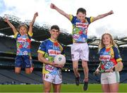 20 April 2022; Kellogg and the GAA have today announced the most hotly anticipated summer camp, Kellogg’s GAA Cúl Camps, has returned for 2022. The Camps are anticipating an extra level of excitement this year with numbers back at full capacity across the country following Covid restrictions. Camps will kick off on Monday, June 27th and will run up to August 26th. GAA clubs across the country are set to be a hive of activity this summer with bookings for participants aged 6-13 now open. For more information visit: www.gaa.ie/kelloggsculcamps. Our picture shows Mayo footballer Tommy Conroy and Antrim camogie player Roisin McCormick with Portia McLaughlin, age 7, from Dublin, and Donnacha Lally, age 11 from Ahascragh-Fohenagh GAA, Galway, during the Launch of the 2022 Kellogg’s GAA Cúl Camps at Croke Park in Dublin. Photo by Stephen McCarthy/Sportsfile