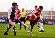 18 April 2022; Matty Smith of Derry City and Andrew Quinn of Drogheda United during the SSE Airtricity League Premier Division match between Drogheda United and Derry City at Head in the Game Park in Drogheda, Louth. Photo by Ben McShane/Sportsfile
