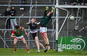 20 April 2022; Mayo goalkeeper Bryan O'Flaherty fails to save the shot of Jack Lavin of Sligo, not pictured, whilst under pressure from Brian Byrne of Sligo during the EirGrid Connacht GAA Football Under 20 Championship Final match between Mayo and Sligo at Markievicz Park in Sligo. Photo by Sam Barnes/Sportsfile