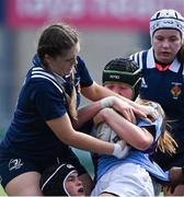 21 April 2022; Jane Neil of South East is tackled by Hannah Wilson of North Midlands during the Leinster Rugby Under 18 Sarah Robinson Cup Final Round match between South East and North Midlands at Energia Park in Dublin. Photo by Brendan Moran/Sportsfile
