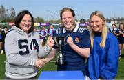 21 April 2022; The North Midlands co-captains Koren Dunne, centre, and Alanna Fitzpatrick are presented with the Sarah Robinson cup by Majella Robinson, mother of Sarah Robinson, after the Leinster Rugby Under 18 Sarah Robinson Cup Final Round match between South East and North Midlands at Energia Park in Dublin. Photo by Brendan Moran/Sportsfile