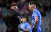 21 April 2022; Adam Waddick of Dublin is booked by referee Anthony Nolan during the EirGrid Leinster GAA Football U20 Championship Semi-Final match between Dublin and Meath at Parnell Park in Dublin. Photo by Ray McManus/Sportsfile