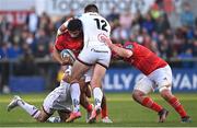 22 April 2022; Damian de Allende of Munster is tackled by Mike Lowry, left, and Stuart McCloskey of Ulster during the United Rugby Championship match between Ulster and Munster at Kingspan Stadium in Belfast. Photo by Ramsey Cardy/Sportsfile