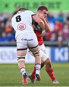 22 April 2022; Alex Kendellen of Munster is tackled by Nick Timoney of Ulster during the United Rugby Championship match between Ulster and Munster at Kingspan Stadium in Belfast. Photo by Ramsey Cardy/Sportsfile