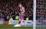 22 April 2022; Bohemians goalkeeper James Talbot removes a flare from the pitch before the SSE Airtricity League Premier Division match between Bohemians and Shamrock Rovers at Dalymount Park in Dublin. Photo by Stephen McCarthy/Sportsfile