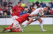 22 April 2022; James Hume of Ulster is tackled by Jean Kleyn of Munster during the United Rugby Championship match between Ulster and Munster at Kingspan Stadium in Belfast. Photo by Ramsey Cardy/Sportsfile