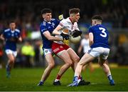 22 April 2022; Lórcan McGarrity of Tyrone in action against Cathal Leddy, left, and Cian Reilly of Cavan during the EirGrid Ulster GAA Football U20 Championship Final match between Cavan and Tyrone at Brewster Park in Enniskillen, Fermanagh. Photo by David Fitzgerald/Sportsfile