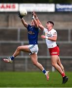 22 April 2022; Brian O'Rourke of Cavan in action against Michael McGleenan of Tyrone during the EirGrid Ulster GAA Football U20 Championship Final match between Cavan and Tyrone at Brewster Park in Enniskillen, Fermanagh. Photo by David Fitzgerald/Sportsfile