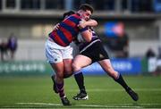 22 April 2022; Dylan Lynch of Clontarf is tackled by Niall Lalor of Terenure College during the Leinster Rugby Bank of Ireland Metropolitan Cup Final match between Terenure College and Clontarf at Energia Park in Dublin. Photo by Ben McShane/Sportsfile
