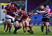 22 April 2022; James Byrne of Clontarf is tackled by Harry O'Neill, left, and Harry O'Donnell of Terenure College during the Leinster Rugby Bank of Ireland Metropolitan Cup Final match between Terenure College and Clontarf at Energia Park in Dublin. Photo by Ben McShane/Sportsfile