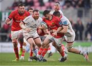 22 April 2022; Diarmuid Barron of Munster is tackled by Nick Timoney of Ulster during the United Rugby Championship match between Ulster and Munster at Kingspan Stadium in Belfast. Photo by Ramsey Cardy/Sportsfile