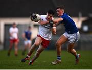 22 April 2022; Niall Devlin of Tyrone in action against Tiarnan Madden of Cavan during the EirGrid Ulster GAA Football U20 Championship Final match between Cavan and Tyrone at Brewster Park in Enniskillen, Fermanagh. Photo by David Fitzgerald/Sportsfile