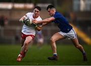 22 April 2022; Ruairí Canavan of Tyrone in action against Cormac Brady of Cavan during the EirGrid Ulster GAA Football U20 Championship Final match between Cavan and Tyrone at Brewster Park in Enniskillen, Fermanagh. Photo by David Fitzgerald/Sportsfile