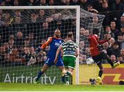 22 April 2022; Junior Ogedi-Uzokwe of Bohemians shoots to score his side's first goal past Shamrock Rovers goalkeeer Alan Mannus during the SSE Airtricity League Premier Division match between Bohemians and Shamrock Rovers at Dalymount Park in Dublin. Photo by Stephen McCarthy/Sportsfile