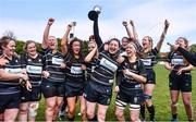 23 April 2022; Kilkenny RFC captain Emer Kelly celebrates with the cup and her teammates after her side's victory in the Division 5 Cup Final match between Kilkenny RFC and Tallaght RFC at Ollie Campbell Park, Old Belvedere RFC in Dublin. Photo by Ben McShane/Sportsfile