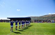 23 April 2022; The Cavan team during the playing of the National Anthem before the Ulster GAA Football Senior Championship Quarter-Final match between Antrim and Cavan at Corrigan Park in Belfast. Photo by Ramsey Cardy/Sportsfile