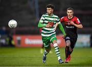 22 April 2022; Danny Mandroiu of Shamrock Rovers in action against Tyreke Wilson of Bohemians during the SSE Airtricity League Premier Division match between Bohemians and Shamrock Rovers at Dalymount Park in Dublin. Photo by Stephen McCarthy/Sportsfile