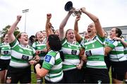 23 April 2022; Naas captain Clare Finn, left, and vice-captain Aisling Mahon lift the cup with their teammates after the Paul Cusack Cup Final match between Wicklow J1 and Naas RFC at Ollie Campbell Park, Old Belvedere RFC in Dublin. Photo by Ben McShane/Sportsfile