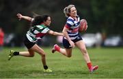 23 April 2022; Laura Delaney of Blackrock RFC J1 gets past the tackle of Ruth Weakliam of Balbriggan RFC during the Paul Flood Plate Final match between Blackrock RFC J1 and Balbriggan RFC at Ollie Campbell Park, Old Belvedere RFC in Dublin. Photo by Ben McShane/Sportsfile