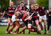 23 April 2022; Emer Feighery of Tullamore RFC is tackled by Tullow RFC players Tara Buggie, left, and Niamh Bailey during the Paul Flood Cup Final match between BTullamore RFC and Tullow RFC at Ollie Campbell Park, Old Belvedere RFC in Dublin. Photo by Ben McShane/Sportsfile