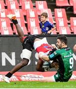 23 April 2022; Coalin Blade of Connacht is tackled by Rabz Maxwane of Emirates Lions during the United Rugby Championship match between Emirates Lions and Connacht at Emirates Airline Park in Johannesburg, South Africa. Photo by Sydney Seshibedi/Sportsfile