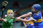23 April 2022; Roisín Howard of Tipperary in action against Stephanie Wolfe of Limerick during the Munster Senior Camogie Championship Quarter-Final match between Tipperary and Limerick at TUS Gaelic Grounds in Limerick. Photo by Ray McManus/Sportsfile