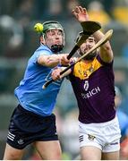 23 April 2022; Connal Flood of Wexford in action against James Madden of Dublin during the Leinster GAA Hurling Senior Championship Round 2 match between Wexford and Dublin at Chadwicks Wexford Park in Wexford. Photo by Eóin Noonan/Sportsfile
