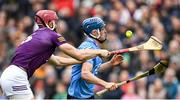 23 April 2022; Rian McBride of Dublin is tackled by Paudie Foley of Wexford during the Leinster GAA Hurling Senior Championship Round 2 match between Wexford and Dublin at Chadwicks Wexford Park in Wexford. Photo by Eóin Noonan/Sportsfile