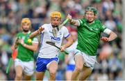 23 April 2022; Jack Prendergast of Waterford is tackled by William O'Donoghue, right, of Limerick during the Munster GAA Hurling Senior Championship Round 2 match between Limerick and Waterford at TUS Gaelic Grounds in Limerick. Photo by Ray McManus/Sportsfile