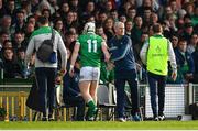 23 April 2022; Limerick manager John Kiely with Cian Lynch as he leaves the pitch to receive medical attention during the Munster GAA Hurling Senior Championship Round 2 match between Limerick and Waterford at TUS Gaelic Grounds in Limerick. Photo by Stephen McCarthy/Sportsfile