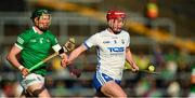 23 April 2022; Calum Lyons of Waterford in action against William O'Donoghue of Limerick during the Munster GAA Hurling Senior Championship Round 2 match between Limerick and Waterford at TUS Gaelic Grounds in Limerick. Photo by Ray McManus/Sportsfile