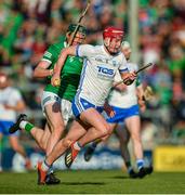 23 April 2022; Calum Lyons of Waterford in action against William O'Donoghue of Limerick during the Munster GAA Hurling Senior Championship Round 2 match between Limerick and Waterford at TUS Gaelic Grounds in Limerick. Photo by Ray McManus/Sportsfile