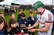 23 April 2022; Cathal Mannion of Galway signs hurleys for supporters after his side's victory in the Leinster GAA Hurling Senior Championship Round 2 match between Galway and Westmeath at Pearse Stadium in Galway. Photo by Seb Daly/Sportsfile