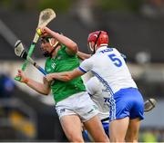 23 April 2022; Gearoid Hegarty of Limerick is tackled by Jack Fagan, 5, and Conor Prunty of Waterford during the Munster GAA Hurling Senior Championship Round 2 match between Limerick and Waterford at TUS Gaelic Grounds in Limerick. Photo by Ray McManus/Sportsfile