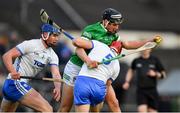 23 April 2022; Gearoid Hegarty of Limerick is tackled by Jack Fagan, 5, and Conor Prunty of Waterford during the Munster GAA Hurling Senior Championship Round 2 match between Limerick and Waterford at TUS Gaelic Grounds in Limerick. Photo by Ray McManus/Sportsfile