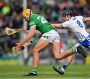 23 April 2022; Cathal O'Neill of Limerick is tackled by Darragh Lyons of Waterford during the Munster GAA Hurling Senior Championship Round 2 match between Limerick and Waterford at TUS Gaelic Grounds in Limerick. Photo by Ray McManus/Sportsfile
