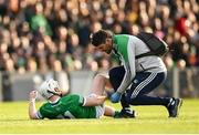 23 April 2022; Cian Lynch of Limerick receives medical attention from chartered Physiotherapist Mark Melbourne during the Munster GAA Hurling Senior Championship Round 2 match between Limerick and Waterford at TUS Gaelic Grounds in Limerick. Photo by Stephen McCarthy/Sportsfile