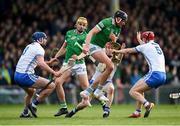 23 April 2022; Gearoid Hegarty of Limerick in action against Waterford players, from left, Conor Prunty, Tadhg De Burca and Jack Fagan during the Munster GAA Hurling Senior Championship Round 2 match between Limerick and Waterford at TUS Gaelic Grounds in Limerick. Photo by Stephen McCarthy/Sportsfile