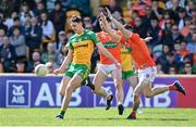 24 April 2022; Michael Langan of Donegal in action against Aidan Forker, left, and Rory Grugan of Armagh during the Ulster GAA Football Senior Championship Quarter-Final match between Donegal and Armagh at Páirc MacCumhaill in Ballybofey, Donegal. Photo by Ramsey Cardy/Sportsfile