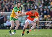24 April 2022; Connaire Mackin of Armagh in action against Eoghan Ban Gallagher of Donegal during the Ulster GAA Football Senior Championship Quarter-Final match between Donegal and Armagh at Páirc MacCumhaill in Ballybofey, Donegal. Photo by Ramsey Cardy/Sportsfile