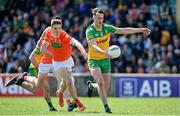 24 April 2022; Jason McGee of Donegal in action against Jarly Óg Burns of Armagh during the Ulster GAA Football Senior Championship Quarter-Final match between Donegal and Armagh at Páirc MacCumhaill in Ballybofey, Donegal. Photo by Ramsey Cardy/Sportsfile