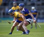 24 April 2022; John McGrath of Tipperary is tackled by Rory Hayes of Clare during the Munster GAA Hurling Senior Championship Round 2 match between Tipperary and Clare at FBD Semple Stadium in Thurles, Tipperary. Photo by Ray McManus/Sportsfile