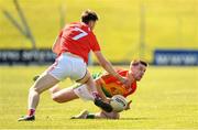 24 April 2022; John Moore of Carlow in action against John Clutterbuck of Louth during the Leinster GAA Football Senior Championship Round 1 match between Louth and Carlow at Páirc Tailteann in Navan, Meath. Photo by Eóin Noonan/Sportsfile