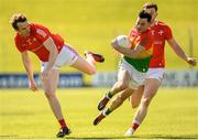 24 April 2022; Jamie Clarke of Carlow is tackled by Bevan Duffy of Louth during the Leinster GAA Football Senior Championship Round 1 match between Louth and Carlow at Páirc Tailteann in Navan, Meath. Photo by Eóin Noonan/Sportsfile