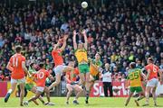 24 April 2022; Donegal players, from left, Jason McGee, and Michael Langan compete for possession with Rian O'Neill of Armagh during the Ulster GAA Football Senior Championship Quarter-Final match between Donegal and Armagh at Páirc MacCumhaill in Ballybofey, Donegal. Photo by Ramsey Cardy/Sportsfile