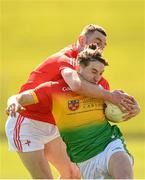 24 April 2022; Conor Crowley of Carlow is tackled by Niall Sharkey of Louth during the Leinster GAA Football Senior Championship Round 1 match between Louth and Carlow at Páirc Tailteann in Navan, Meath. Photo by Eóin Noonan/Sportsfile